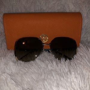 Tory Burch oversized sunglasses.
